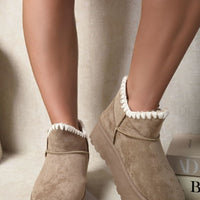 Khaki suede ankle boots with faux fur lining, side buckle strap, and chunky platform sole.
