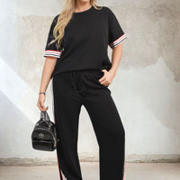 Black short-sleeve top and wide-leg trousers co-ord set with contrast stripe cuffs