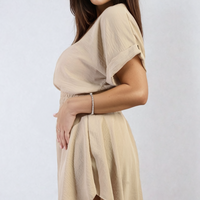 Light beige roll-sleeve top and elastic shirred waist shorts co-ord set