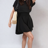 Black roll-sleeve top and elastic shirred-waist shorts co-ord set