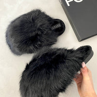 Pair of black faux fur winter sandals, slip-on slides with fuzzy straps