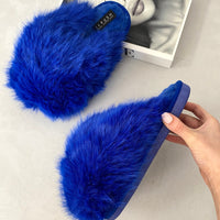 Faux fur winter sandals in bright blue, slip-on slide with thick cushioned sole