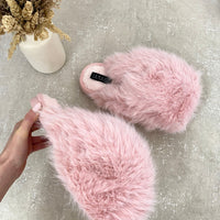 Pink fluffy faux-fur slide sandals with plush strap and open-toe silhouette