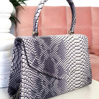 Faux Leather Handbag in Lilac with Top Handle and Chain Strap