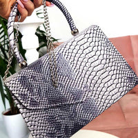 Faux Leather Handbag in Lilac with Top Handle and Chain Strap