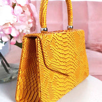 Faux Leather Handbag in Lilac with Top Handle and Chain Strap