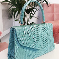 Faux Leather Handbag in Lilac with Top Handle and Chain Strap