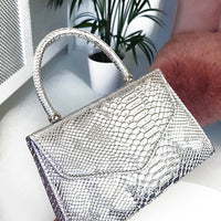 Faux Leather Handbag in Lilac with Top Handle and Chain Strap