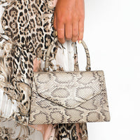Faux Leather Handbag in Lilac with Top Handle and Chain Strap