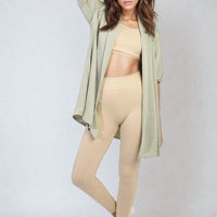 Light green open-front cardigan with roll-up sleeves, relaxed fit