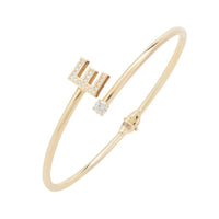 Gold-tone initial E bangle bracelet with square crystal accents