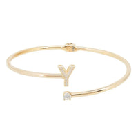 Gold-tone bangle bracelet featuring initial Y with crystal detail