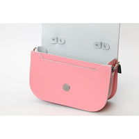 Pastel pink leather crossbody bag back with snap hardware and D-rings