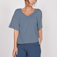 Oversized blue v-neck t-shirt, loose short sleeves and relaxed neckline