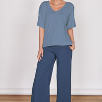 Oversized blue v-neck t-shirt with short sleeves, relaxed drape