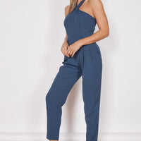 Navy tailored sleeveless jumpsuit with high cross halter neck and tapered legs
