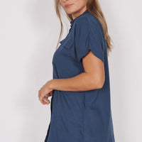 Navy utility shirt with short sleeves and button-front; side view with chest pocket