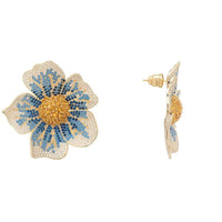 Gold-tone stud earrings shaped like blue and gold flowers