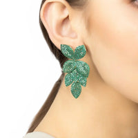 Emerald green rhinestone flower drop earrings on gold hooks, side view