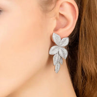 Silver floral drop earrings with three layered petal shapes