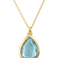 Gold teardrop pendant necklace with blue topaz on linked chain