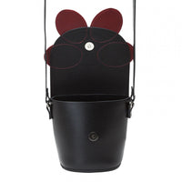 Black leather barrel bag with red-and-black daisy applique and hanging shoulder straps