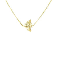 Gold-tone chain necklace with small winged bee charm at center
