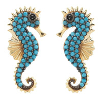 Gold-tone seahorse earrings with turquoise bead clusters and black eye detail