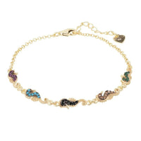 Gold seahorse charm bracelet with multicolor enamel links on a fine chain