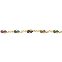 Gold seahorse charm bracelet close-up with tiny blue, purple, and black charms