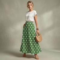 Green polka-dot midi skirt with high waist, full A-line flare