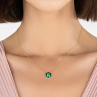 Gold-tone chain necklace with small green enamel Star of David pendant