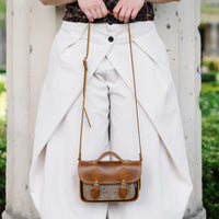 Tan leather and tweed micro crossbody satchel with front flap and adjustable strap