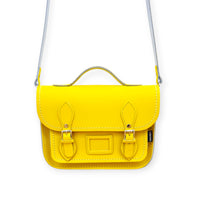 Pastel yellow leather midi satchel with front flap and adjustable shoulder strap