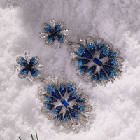 Pair of silver-tone crystal flower drop earrings with ice blue gradient petals