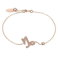 Rose gold Capricorn zodiac charm bracelet with glitter symbol and round clasp