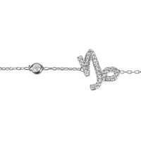 Silver Capricorn charm bracelet close-up with round link and glitter symbol