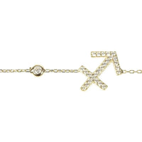 Gold Sagittarius bracelet detail with crystal arrow star sign charm and round clasp