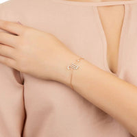 Rose-gold tone Scorpio star sign bracelet with rhinestone scorpion charm detail
