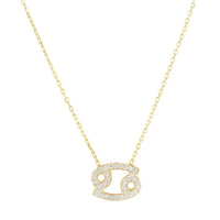 Gold zodiac pendant necklace with studded Cancer charm and linked chain