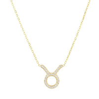 Gold-tone zodiac Taurus pendant necklace with small round stone halo charm