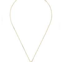 Gold gemstone pendant necklace with small square peridot-green stone on thin chain