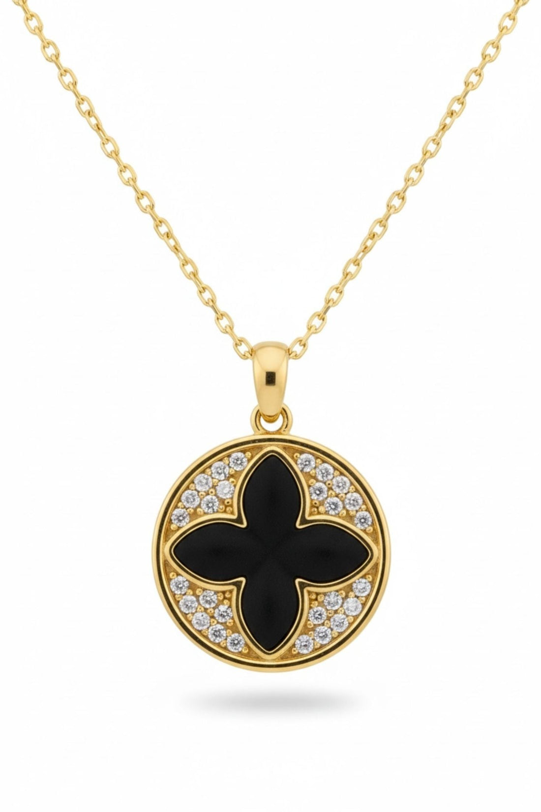 Gold necklace with round clover pendant, black enamel center and crystal border