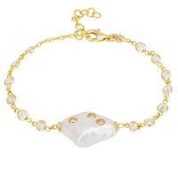 Gold bracelet with white heart charm and small round pearl-like accents