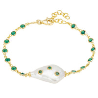Gold bracelet with white pearl centerpiece and emerald green round accents
