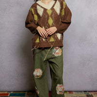 Brown argyle V-neck mohair sweater with long cuffed sleeves and contrast exposed stitch detail
