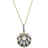 Gold chain necklace with blue scallop shell pendant, pearl center and sapphire accents