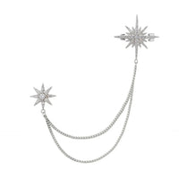 Silver starburst brooch with U-shaped chain and pin backing