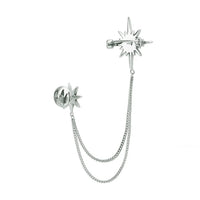 Silver starburst brooch with dangling chain and round back clasp