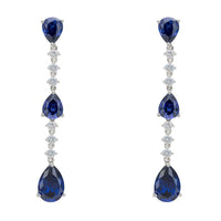 Tanzanite drop earrings with three blue teardrop stones and silver crystal accents